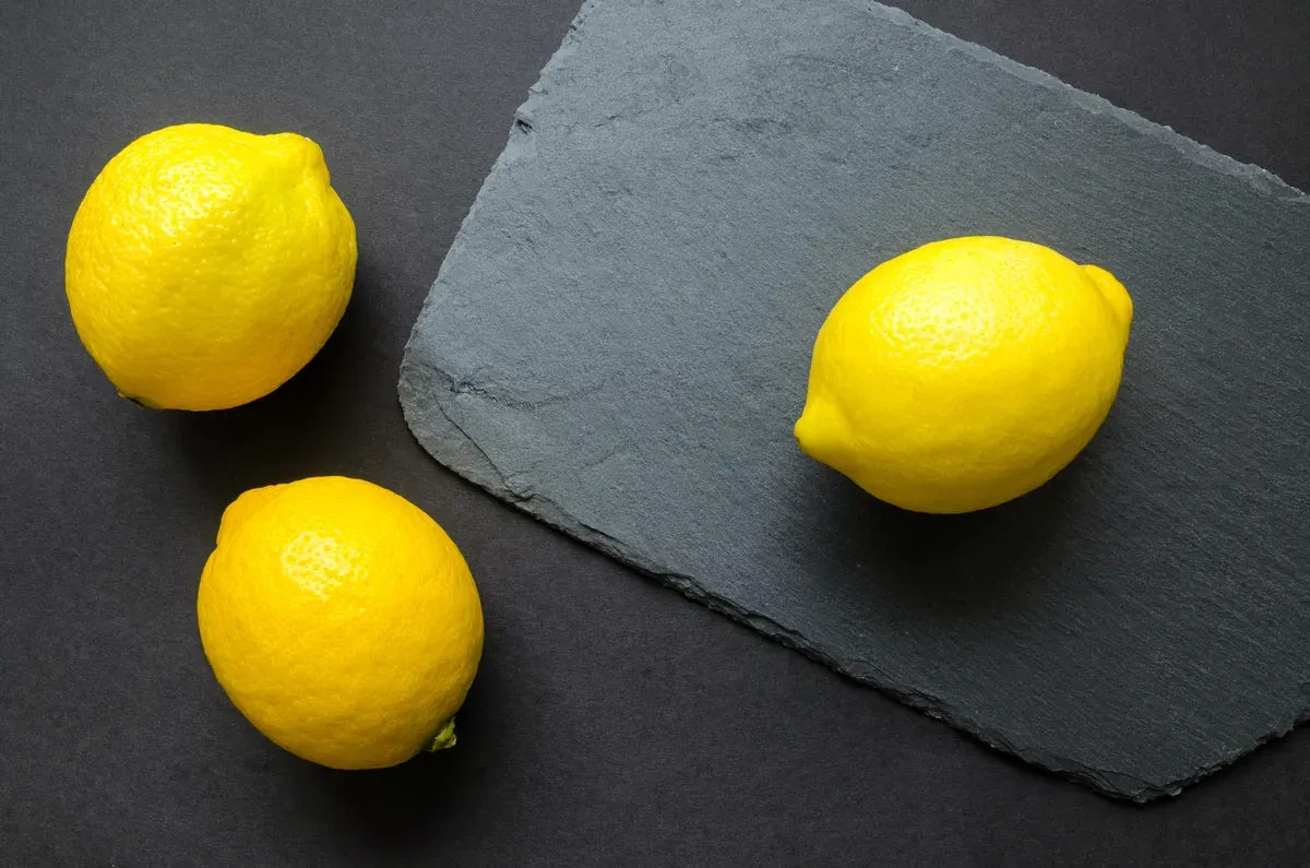 Fresh limes and a cut lemon